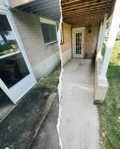 Concrete walkway half washed, showing the clean side next to the dirty side