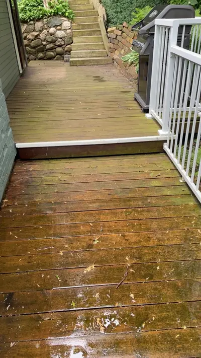 Weathered deck boards before pressure washing