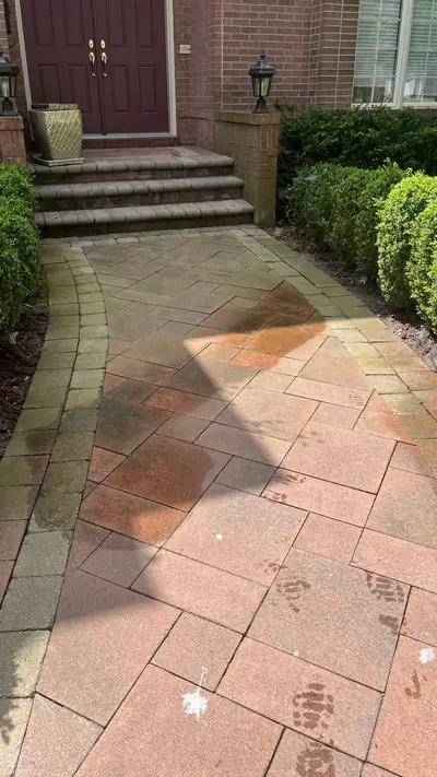 Faded interlock walkway before cleaning