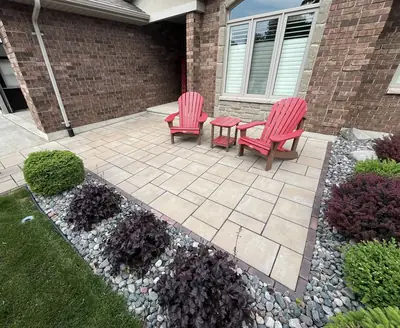 Finished front-entry paver patio with Adirondack chairs