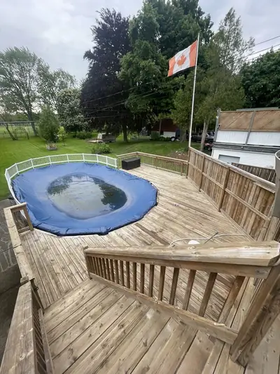 Wooden pool deck and railings cleaned for the season